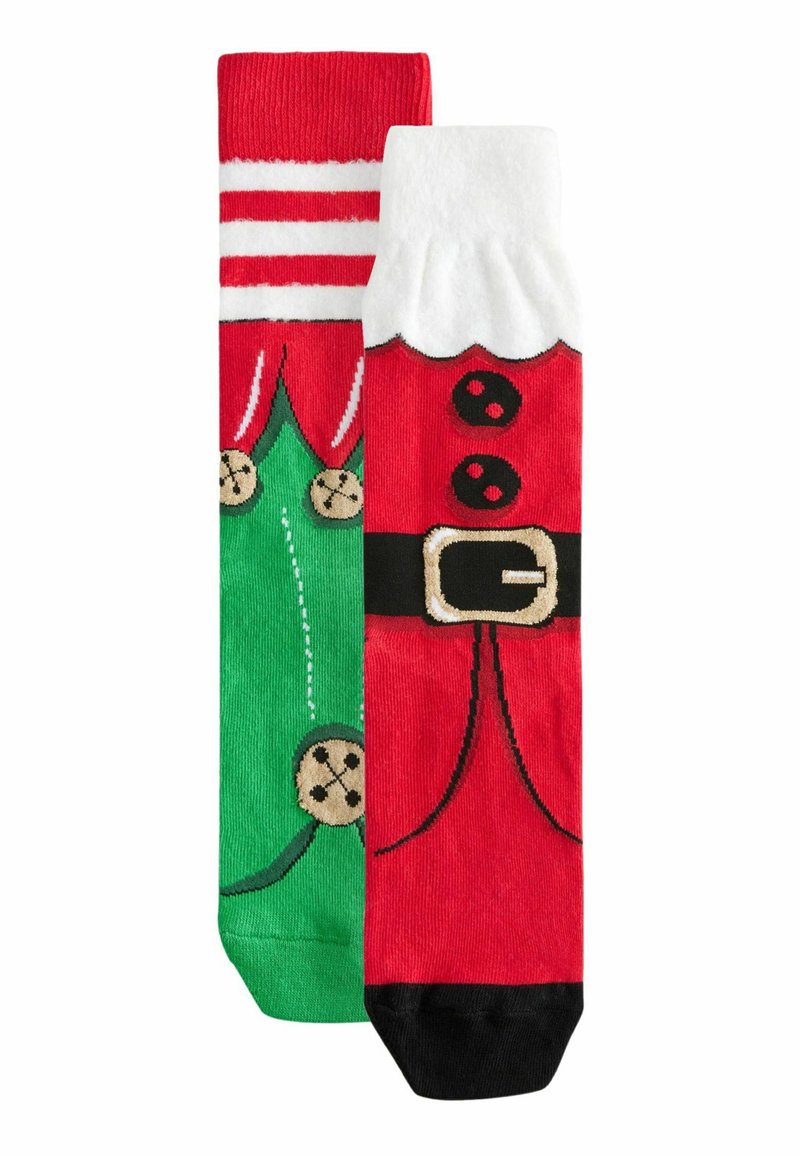 Chaussettes de Noël : l'une verte avec des accents rouges et des motifs de cloches, l'autre rouge avec des détails noirs et blancs ressemblant au costume du Père Noël.