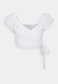 Top avvolgente bianco realizzato in tessuto leggero. Presenta una profonda scollatura a V, maniche a sbuffo e un dettaglio con fiocco in vita.