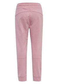 Pantalons de survêtement rose clair en mélange de coton doux. Dotés d'une taille élastique, de jambes fuselées et de poignets côtelés. Texture lisse avec un minimum de détails.