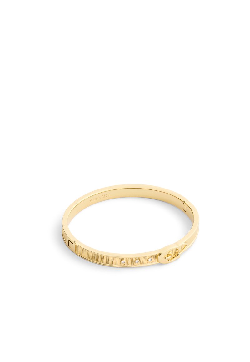 Gold-toned bangle bracelet with engraved lines, three small embedded crystals, and a circular clasp detail on a white background.