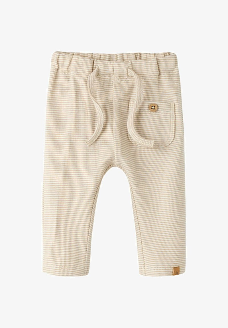 Beige og hvide striped babybukser med elastisk linning, snøre foran, lille forlomme med træknap og et lille brunt mærkat.