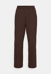 Brown sweatpants with a comfortable elastic waistband, tapered leg design, and soft texture. Feature a subtle embossed brand logo.