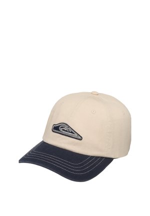 Gorra de béisbol beige con visera curva azul marino y logo bordado en blanco y negro en el panel frontal.