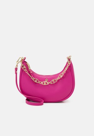 Bright pink crescent-shaped handbag with a detachable gold chain strap and an additional long pink shoulder strap.