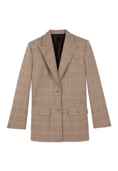 Blazer de doble botonadura en tela a cuadros beige, con solapas rematadas, dos bolsillos frontales y botones dorados. Forro negro visible en el interior.