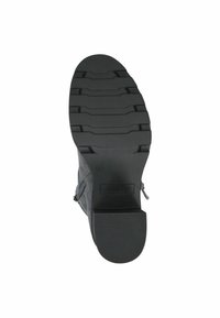 Suela de goma negra con surcos texturizados, unida a una parte superior de ante gris. Presenta un zipper lateral para un fácil uso.
