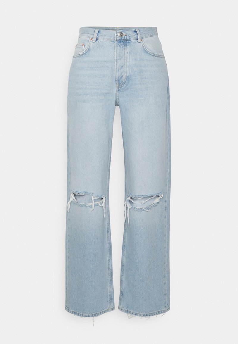 Jeans in denim blu chiaro con vita alta, silhouette a gamba larga e dettagli strappati sulle ginocchia. Finiture a orlo grezzo e leggera scoloritura.
