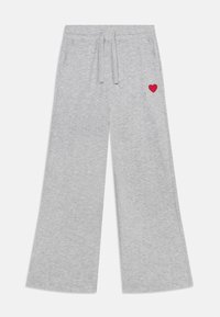 Pantaloni grigi in felpa realizzati in tessuto morbido, con vita regolabile tramite cordoncino e design a gamba larga. Un piccolo cuore rosso è ricamato vicino alla tasca.