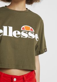 Ellesse Triko s potiskem - khaki