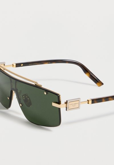 Ορθογώνια πράσινα γυαλιά ηλίου με χρυσό μεταλλικό σκελετό και βραχίονες με σχέδιο χελώνας, με πλακέτα λογότυπου Dolce & Gabbana.
