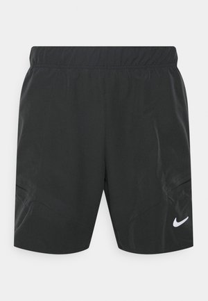 Shorts de sport noirs avec une taille élastique et un logo Nike swoosh blanc sur la partie inférieure de la jambe droite, fabriqués en tissu léger.
