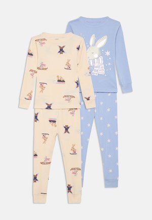 Due set di pigiami per bambini: uno beige con illustrazioni di animali e uno blu con un design di coniglio, realizzati in morbido tessuto di cotone.