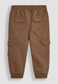 Braune Cargo-Hosen mit einem elastischen Bund, ausgestattet mit zwei großen aufgesetzten Taschen auf der Rückseite und zwei Seitentaschen. Weicher, strukturierter Stoff.