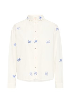 Camisa blanca de manga larga con botones, con pequeños pájaros, flores y manos bordados en azul distribuidos por la tela y el cuello.