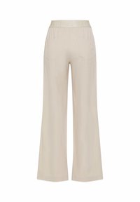 Pantalon beige à jambes larges avec une taille élastique et deux poches arrière, vu de dos.