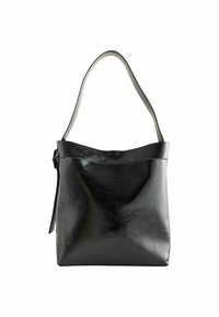 Black leather tote bag with a smooth finish, featuring a single, adjustable shoulder strap and an open-top design. Simple and functional silhouette.