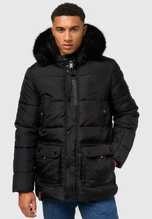 Black puffer jacket with a fur-lined hood, front snap and zip closure, multiple front pockets, and contrasting stitching details.