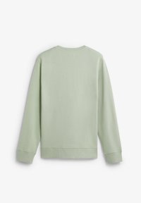 Vihreä pitsihihainen collegepaita, jossa on resorit hihansuissa ja helmassa. Sileä pinta, vähäeleinen muotoilu ilman näkyviä logoja tai kuvioita.