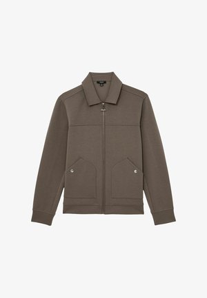 Braune Jacke mit Reißverschluss, spitzem Kragen, langen Ärmeln, zwei Fronttaschen mit Druckknöpfen sowie gerippten Bündchen und Saum.