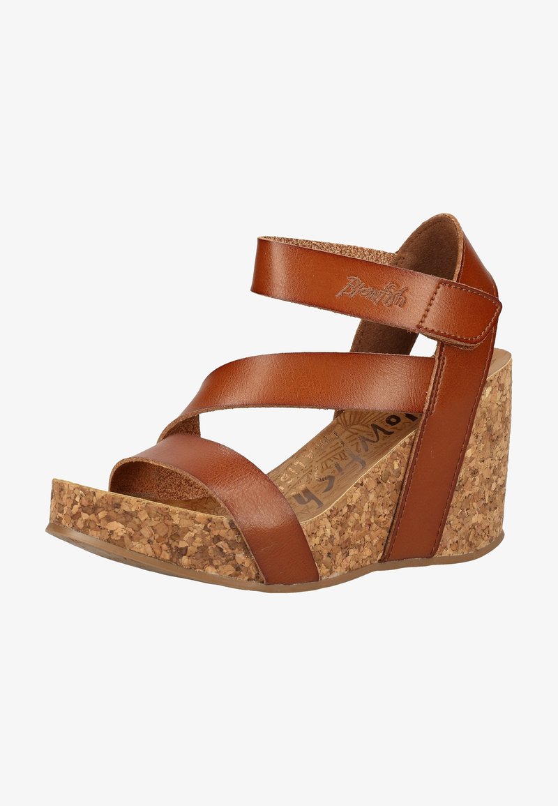 Sandale compensée en cuir marron avec semelle en liège, bout ouvert et bride à la cheville avec fermeture velcro.