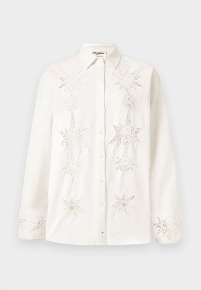 White button-up shirt made of linen, featuring intricate star-shaped embroidery on the front and cuffs, with a classic collar design.