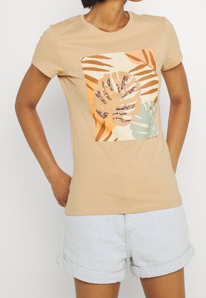 Beige cotton t-shirt with short sleeves, featuring a graphic of green and orange leaves with sequins on a centered design.