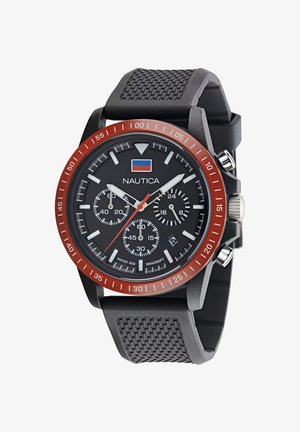 Must mustrikell punase äärega, tekstuuriga kummirihmaga, musta diali ja valgete tunni- ja aladailide markeeringutega.