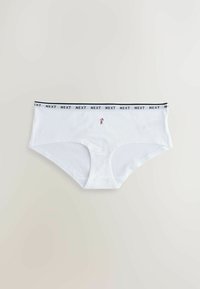 White cotton hipster underwear with a black "NEXT" logo waistband and a small floral embroidery detail at the center front.