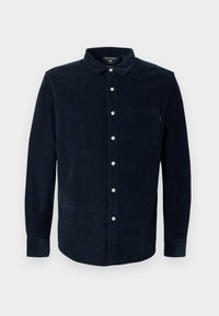 Camisa de pana color marino con mangas largas, cuello abotonado y un bolsillo en el pecho; presenta botones blancos y tejido texturizado.