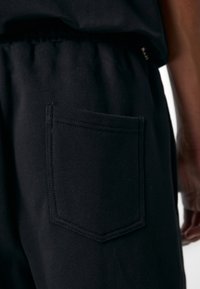 Don't Waste Culture NADIYA UNISEX - Παντελόνι φόρμας - black