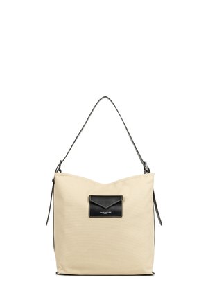 Borsa a spalla in tela beige con tasca e tracolla in pelle nera. Caratterizzata da un design elegante con una parte superiore arrotondata e chiusura con zip.