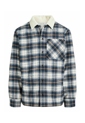 Camicia in flanella a quadri bianca, blu e marrone. Presenta una chiusura a bottoni sul davanti, una tasca sul petto e un colletto foderato in pile per una maggiore calore.