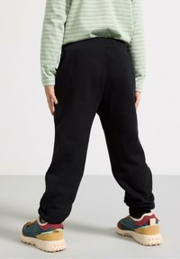 Lindex Jogginghose - black