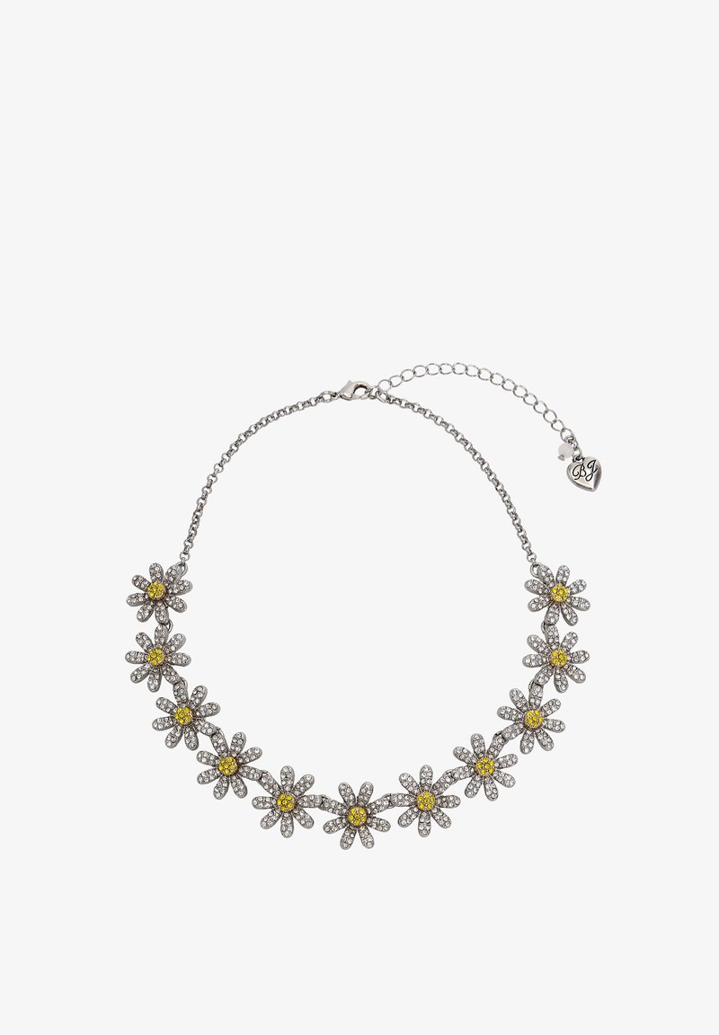 Silver chain necklace featuring daisy-shaped pendants, embellished with clear and yellow stones. Adjustable clasp with heart-shaped tag.