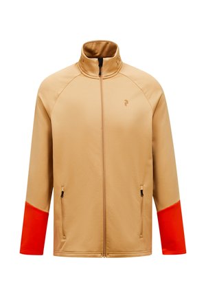 Beige ritsjack met oranje accenten op de mouwen, gemaakt van een gladde stof; heeft dubbele zijzakken en een hoge kraag.