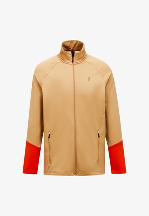 Beige ritsjack met oranje accenten op de mouwen, gemaakt van een gladde stof; heeft dubbele zijzakken en een hoge kraag.