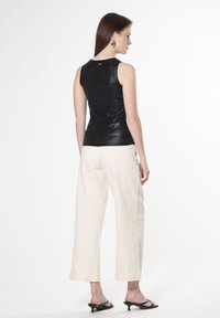 INFLUENCER LAMINATED - Top - black