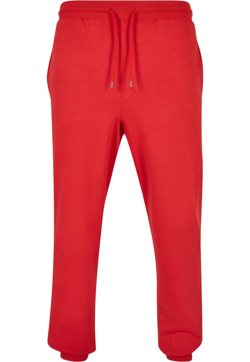 Røde joggebukser laget av mykt stoff, med snor i midjen, ribbede mansjetter og sidelommer. Glatt tekstur og avslappet design.