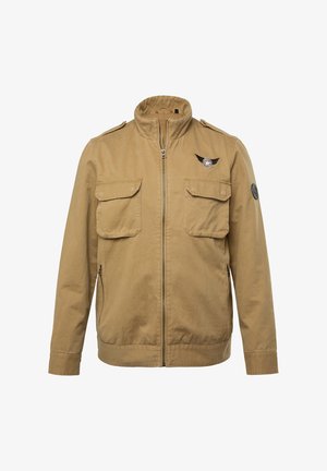 Khaki-Jacke mit hohem Kragen, vorn mit Reißverschluss, zwei Brusttaschen und einem Emblem auf der linken Schulter. Aus Baumwollmaterial mit glatter Textur.