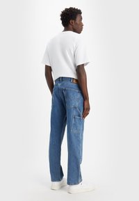Levi's® Workwear 565™ LOOSE STRAIGHT DOUBLE KNEE - Vaqueros boyfriend - ampere
