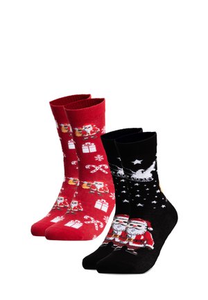 Two pairs of Christmas-themed socks, one red with Santa, gifts, candy canes, the other black with Santa, sleigh, and stars.