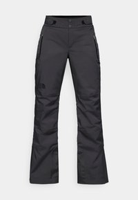 Črne smučarske hlače ravnega kroja, narejene iz trpežnega materiala, z dvema stranskima žepoma na zadrgo in logotipom The North Face na levem hlačniku.