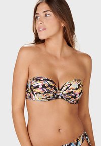 Bikinitopp utan axelband med ett flerfärgat abstrakt mönster på svart bakgrund, med en sweetheart-halsringning och vadderade kupor.