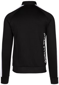 Zwarte sportjack met lange mouwen, witte accenten op de schouders, zachte stof, slim fit ontwerp en het "GORILLA WEAR" logo in het wit op de mouw.