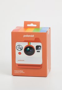 Polaroid Now Instant Camera packaging in orange, featuring a white front with a lens, buttons, and a rainbow accent at the top.