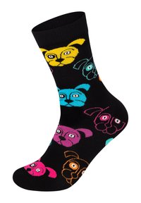 Sorte sokker med farverige, tegneserieagtige hundeansigtter i gul, blå, pink, orange og grøn, med en ribbet kant.