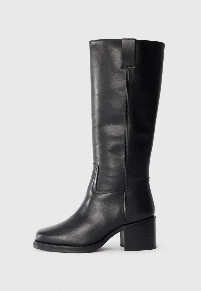 Black leather knee-high boots with a smooth texture, square toe, block heel, and side pull tab, featuring minimal stitching details.