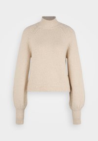 Beżowy sweter dzianinowy z wysokim kołnierzem, raglanowymi rękawami i prążkowanymi mankietami. Miękka struktura z luźnym krojem i długością do połowy brzucha.