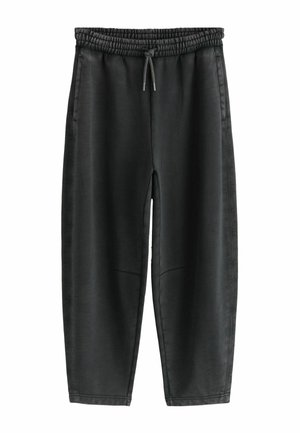 Black, elastic waist pants with a drawstring, featuring a smooth texture, tapered shape, and side pockets for functionality.