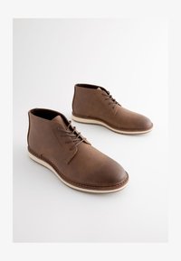 Geselecteerd, tan brown